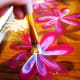 I've finished a set of flowers and now I'm dabbing the center with a scruffy-type brush with sunshine yellow.