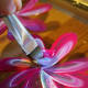 Here, my main color was the magenta, and then I dipped the brush into the secondary colors lavender, followed by sunshine yellow. I start at the center, then round out the brush back to the center to make the petal.