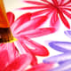 Once you have finished the flowers, practice using a scruffy-like brush to dot the centers of your flowers.