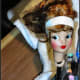 Next, I began to work on the head. Tammy received a rubber band hair band to set her bangs in place. The head was propped up with an eraser pen to check out the damage and make sure the head was in a good position to be completely dry. Glue adhere