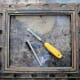 Cleaning old flaky backing paper from back of frame before reassembly