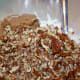 Mixing pecans with flour and brown sugar.