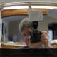 Practically any shiny object can provide a reflective surface for a self portrait. Kitchens are often full of possibilities. I looked out from behind the camera so I'd get more than just the camera in this shot.