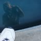Water is another great reflective surface for self portraits. The water in this swimming pool is a little dark, but you can still see me leaning over to get the shot while also capturing my foot.
