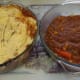 Top one of the casserole dishes with mashed potato