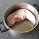 Tongue is added to a large pot for poaching