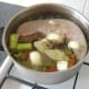 Cold water is added to the pot until the tongue is comfortably covered