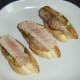 Tuna is laid on salsa and bruschetta