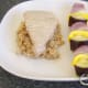 Vegetable shish kebab is plated with tuna and spicy rice