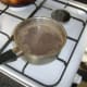 Rice added to water with Lebanese seven spice