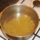 Conchiglie pasta is added to a deep pot of heavily salted water