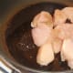 Chicken breast pieces are sealed in olive oil