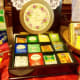 I had to put my tea tin lid in front because of the glare, sorry. It is solid cherry though. The tea tin held a single serve tea set from my hubby.