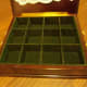 The inside of ours is green velvet lining. Tea leaves sometimes spill in it so you need to vacuum or brush it out at times.