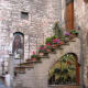 A large fresco-type shrine at the entrance to an upper level apartment. Not the way the shoe shop is built into all the usable space.