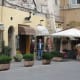 Early morning at a coffee bar with outside seating. Some open as early as 6am to serve morning regulars.
