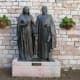 Sculptures of Francis' mother Pica de Bourlemont and father Pietro di Bernardone near the entrance of Chiesa Nuova church, built over their home.