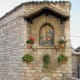 The whole end of this wall is occupied by this shrine and the plants that surround it.