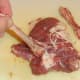 Duck leg bone is scraped clean