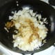 Cooled rice is added to stir fried biryani duck