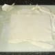 Puff pastry is rolled and trimmed to cover pie