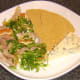 Shredded poached duck leg meat is added to the clementine salad