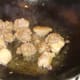 Stir frying diced duck leg meat