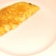 Roast duck leg omelette is plated