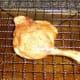 Roast duck leg removed from the oven