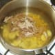 Duck leg meat is added to soup simply to heat through