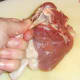 Duck thigh bone is scraped clean
