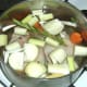 Water is added to duck legs and stock ingredients