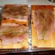 Lay fish on wood planks skin side down.