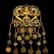Headdress ornament. Tillya Tepe Tomb II, first century A.D. Gold with turquoise, garnet, lapis lazuli, carnelian and pearls 12.5 x 6.5 cm (5 x 2–5/8 in.) Image credit: Metropolitan Museum