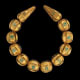 Neck­lace Tillya Tepe Tomb VI, first cen­tury A.D. Gold with gran­u­la­tion and turquoise Diam. of the beads- National Museum of Afghanistan © Thierry Ollivier / Musée Guimet