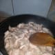 Wait until the pork pieces are at least this done or white, then add water.