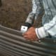 The clips may be installed by a single person, as you can reach over the top edge of the sheet and hold bolts with a box-end wrench while you operate an impact gun with your other hand.