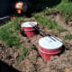 Careful measurements were taken to ensure that the bin would be level and centered on all four barrels. The iron bars are merely being used to square up the barrels.