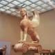 Imposing Archaic sphinx -- note visitor for size -- in the best archaic style, once topped a 33 foot (10 m) tall pillar at the entrance to the Sanctuary of Apollo. A gift from the island of Naxos, which I'll visit later.