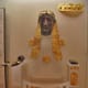 Matching gold and ivory statue of Apollo, again burned. He holds a shallow offering-cup.
