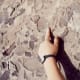 Pointing towards some petrified bone in the rock