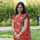 See how just a simple saree and a moderate pose makes this lady look so smart.Decency is explicit in her dressing and smile.