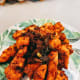 Place the chicken in serving bowl or plate.