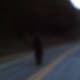 Knobby runs across the road and can be heard to scream or snarl at me as I video taped it. We saw it crossing the road and it was visible for a very few seconds. Not over 10-15 seconds.