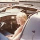 Cheryl sitting in the car KITT.
