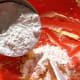 Gradually add the flour into the wet mixture.