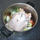 Whole chicken ready to be poached