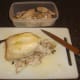 Leg portions and wings have been removed from poached chicken