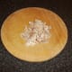 Meat from poached chicken leg is moderately finely chopped