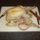 First leg portion is removed from poached chicken
